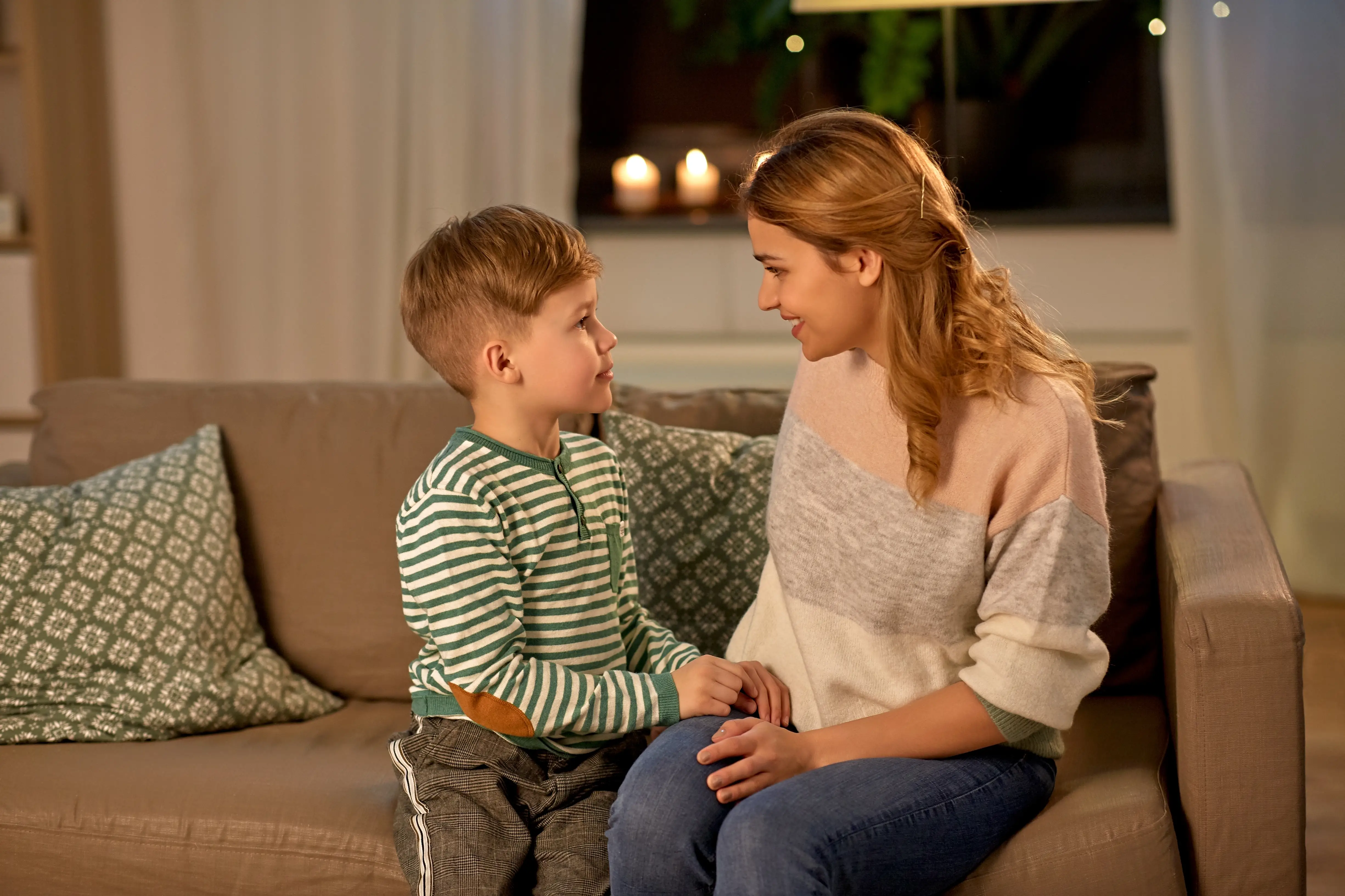 happy-smiling-mother-talking-her-son-home