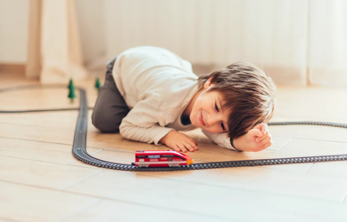 kid-playing-with-toy-train